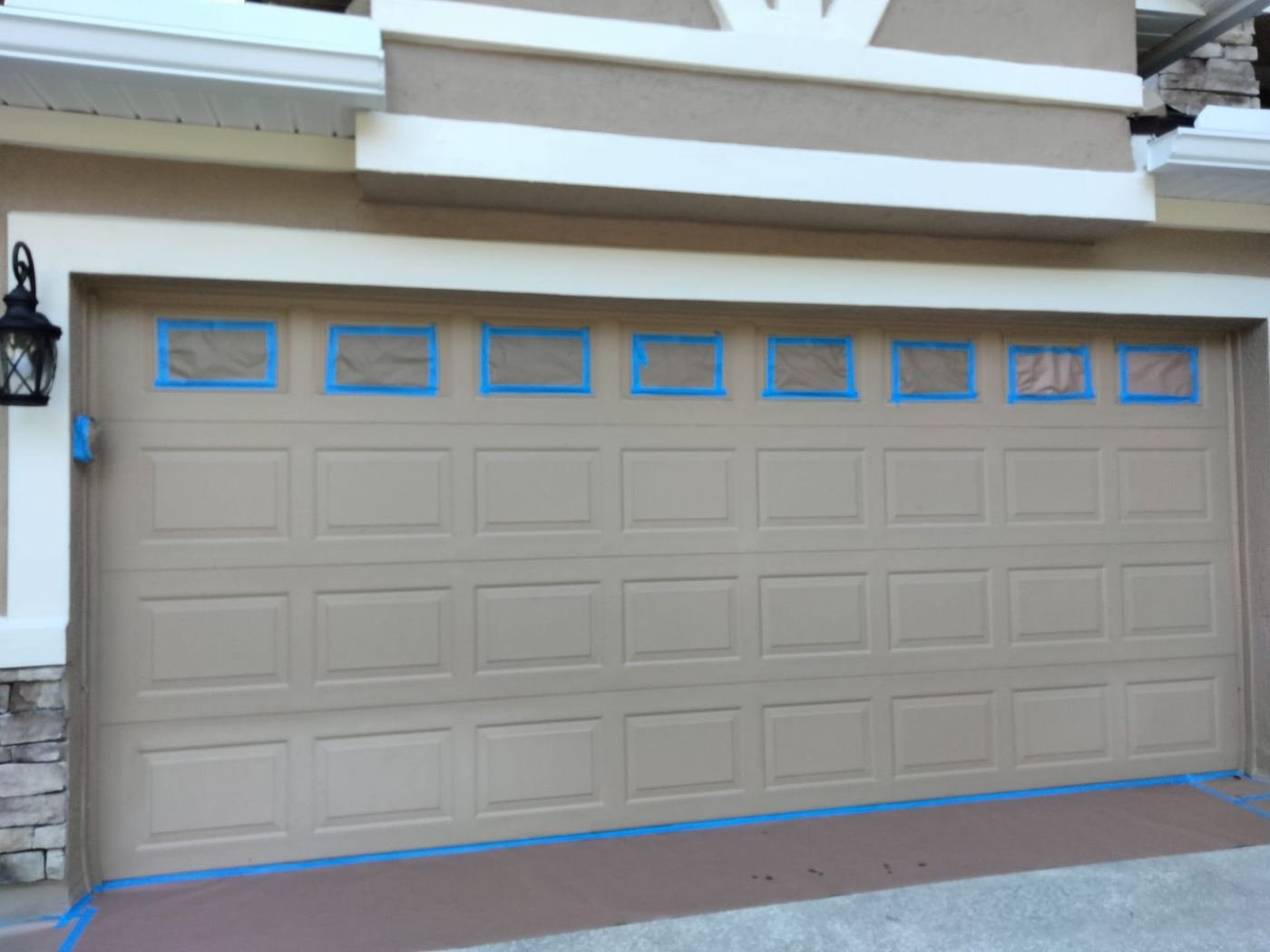 Garage door windows masked before painting