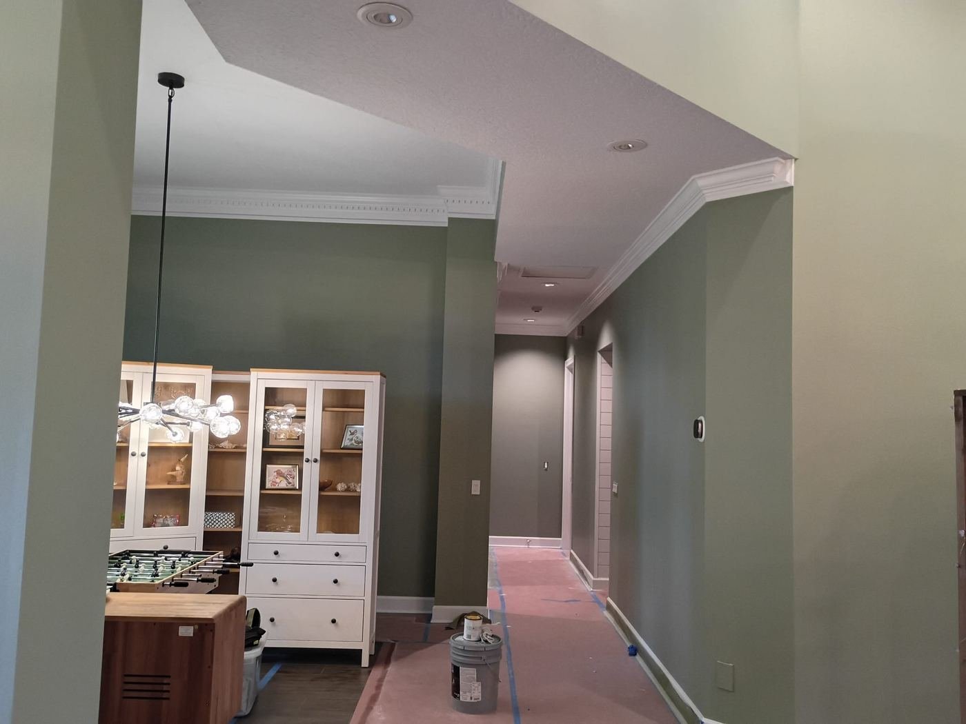 Kitchen and hall in sage green during the job