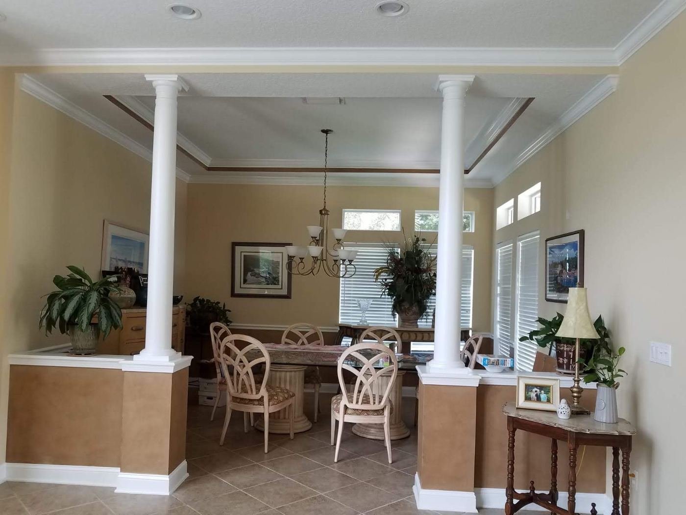 Dining area with painted columns and trim