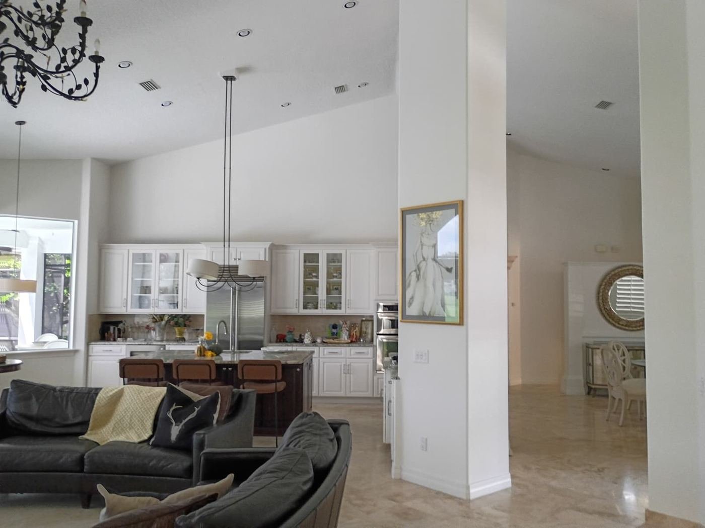 Open living room and kitchen in crisp white