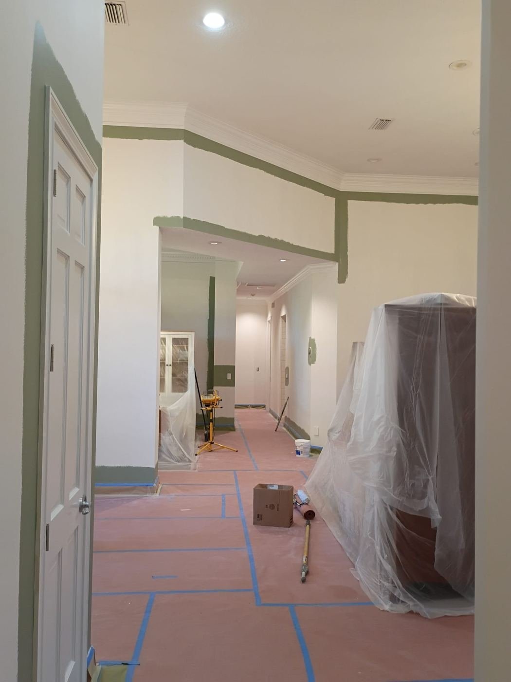 Trim and doorways masked, furniture wrapped