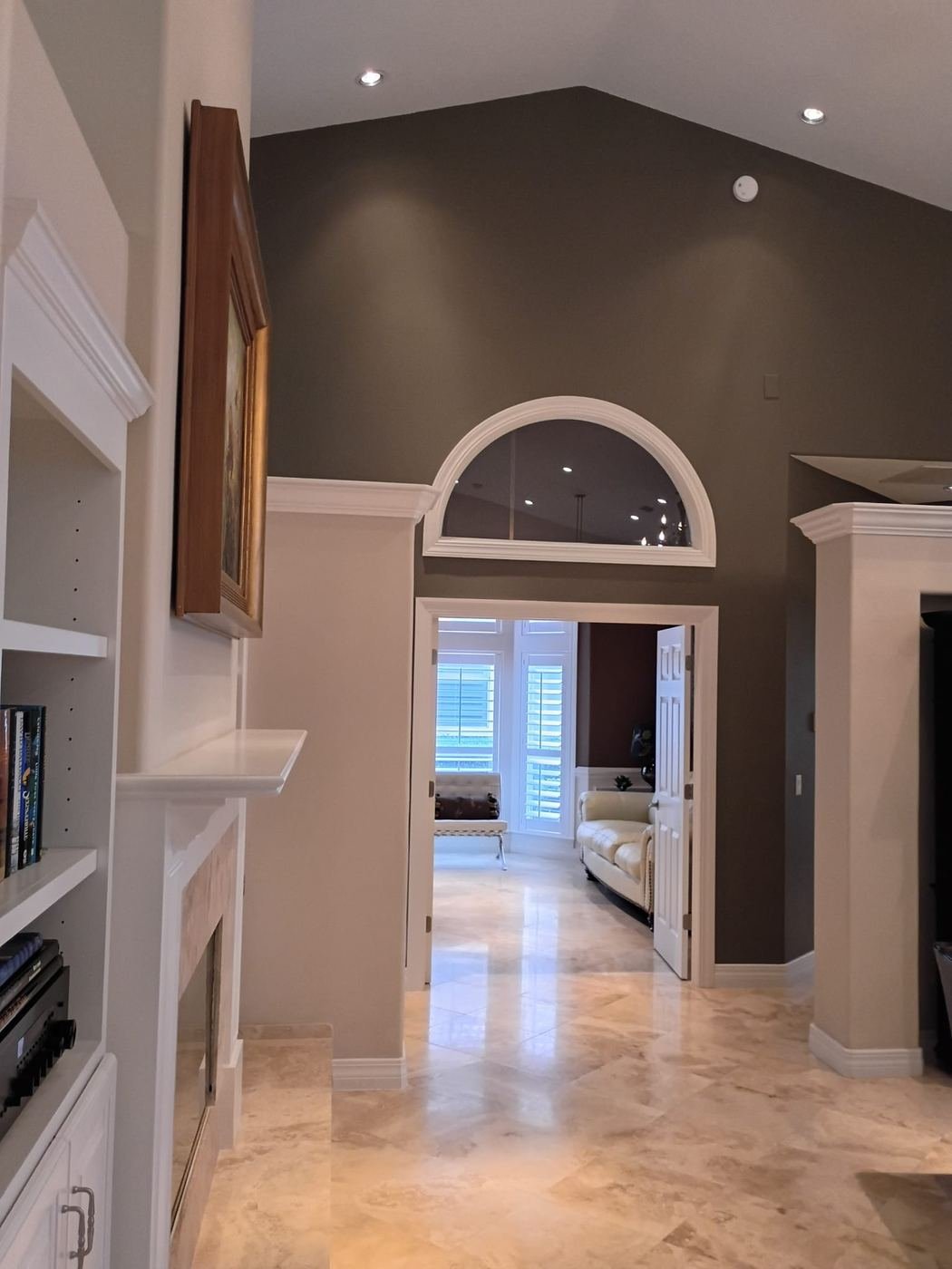 Dark accent wall framing an arched doorway