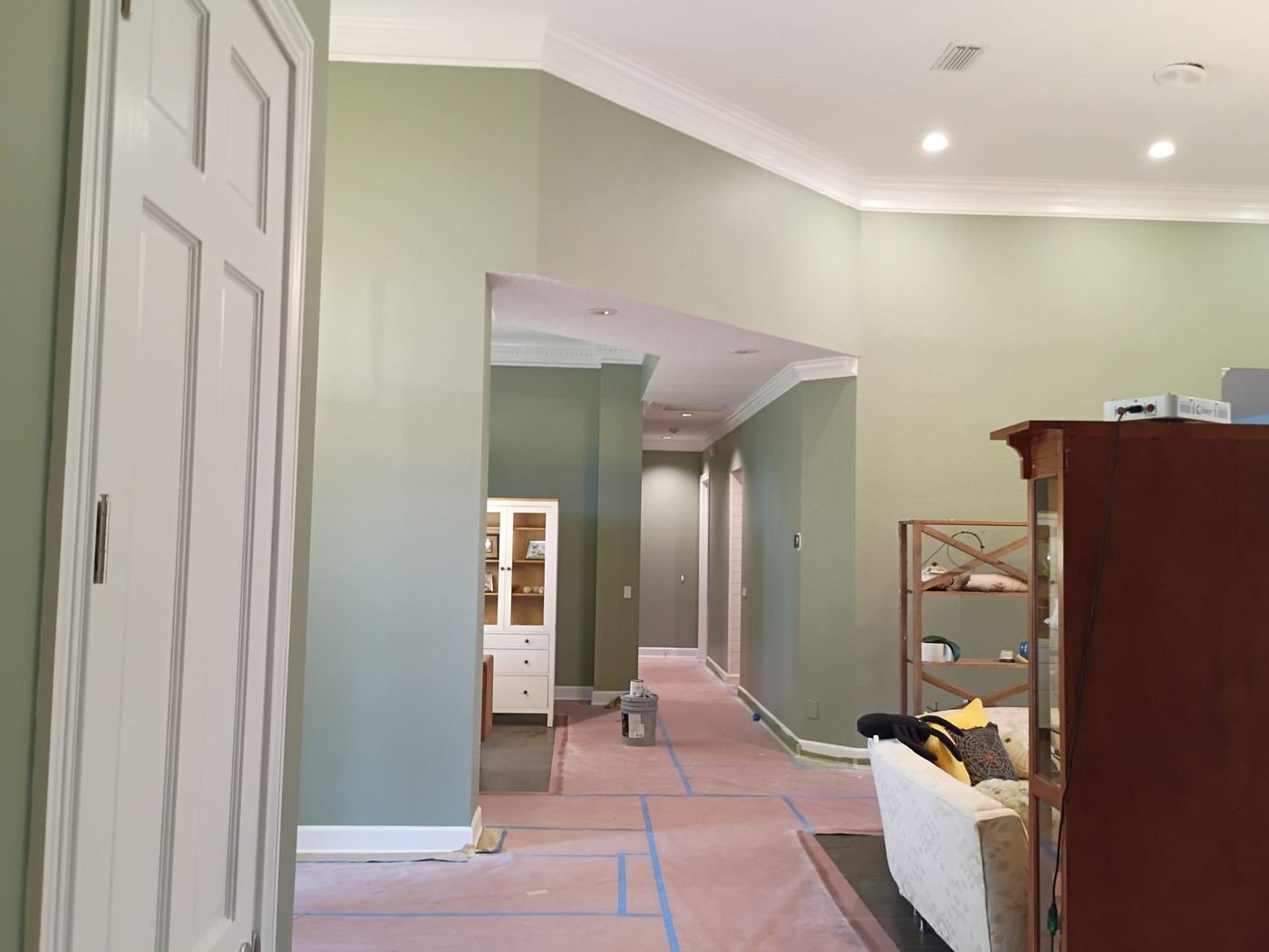 Entry hall in sage green with new white trim