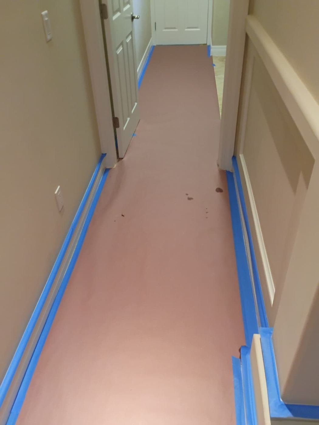 Floors covered and edges taped before work starts