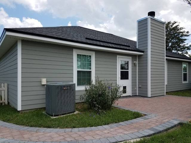 Gray lap siding and white trim, freshly repainted