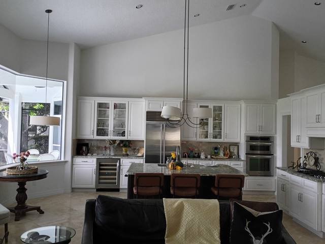 White kitchen cabinets in an open great room