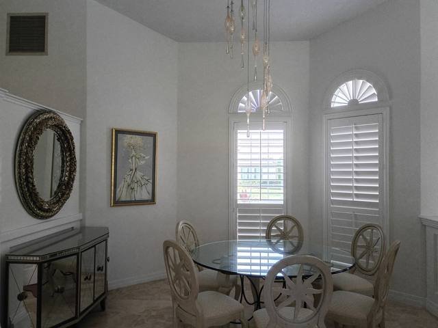 Dining room with arched windows in bright white